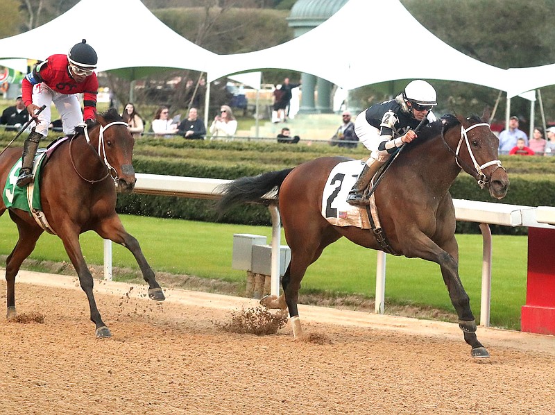 Jockey Joe Talamo guides Shedaresthedevil (2) across the wire in front of Alta’s Award and jockey Ricardo Santana Jr. to win the Honeybee Stakes on March 7 at Oaklawn Park. Shedaresthedevil is currently second in the Road to the Oaks standings. - Photo by Richard Rasmussen of The Sentinel-Record