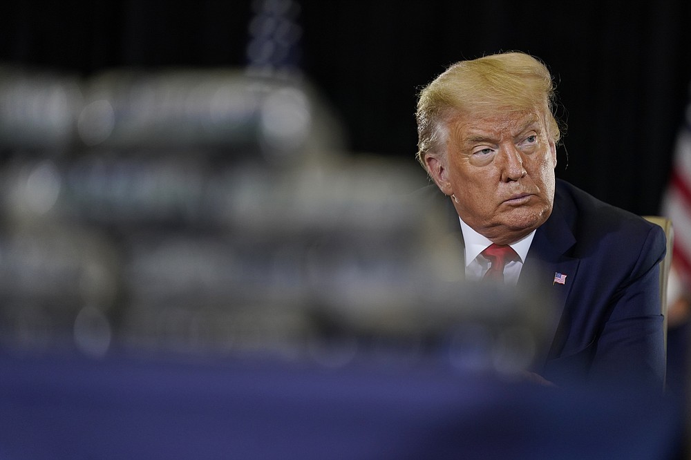 President Donald Trump listens during a briefing on counternarcotics operations at U.S. Southern Command, Friday, July 10, 2020, in Doral, Fla. (AP Photo/Evan Vucci)