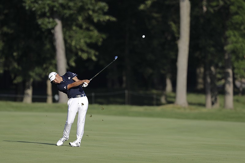 Collin Morikawa hits on the 13th hole during the second round of the Workday Charity Open Friday in Dublin, Ohio. - Photo by Darron Cummings of The Associated Press
