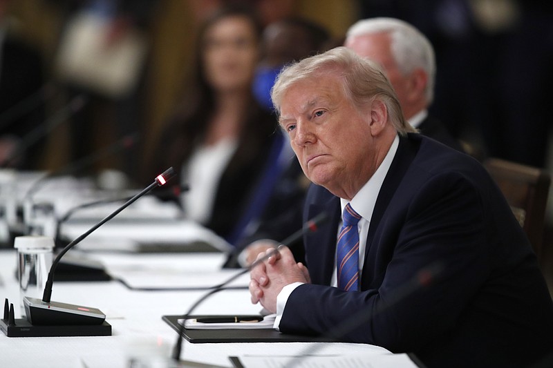 President Donald Trump listens during a "National Dialogue on Safely Reopening America's Schools," event in the East Room of the White House, Tuesday, July 7, 2020, in Washington. (AP Photo/Alex Brandon)