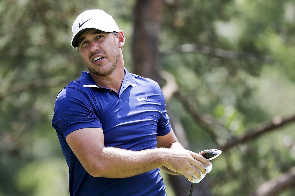 Brooks Koepka watches his drive at the second hole during the second round of the Workday Charity Open golf tournament, Friday, July 10, 2020, in Dublin, Ohio. (AP Photo/Darron Cummings)