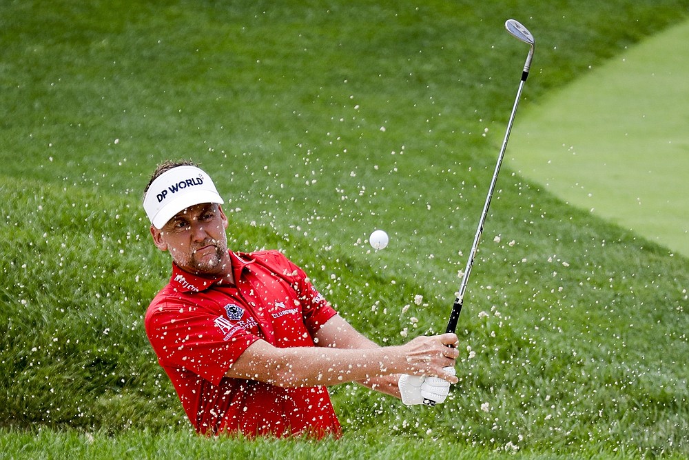 Ian Poulter, of England, hits from a bunker on the 16th hole during the second round of the Workday Charity Open golf tournament, Friday, July 10, 2020, in Dublin, Ohio. (AP Photo/Darron Cummings)