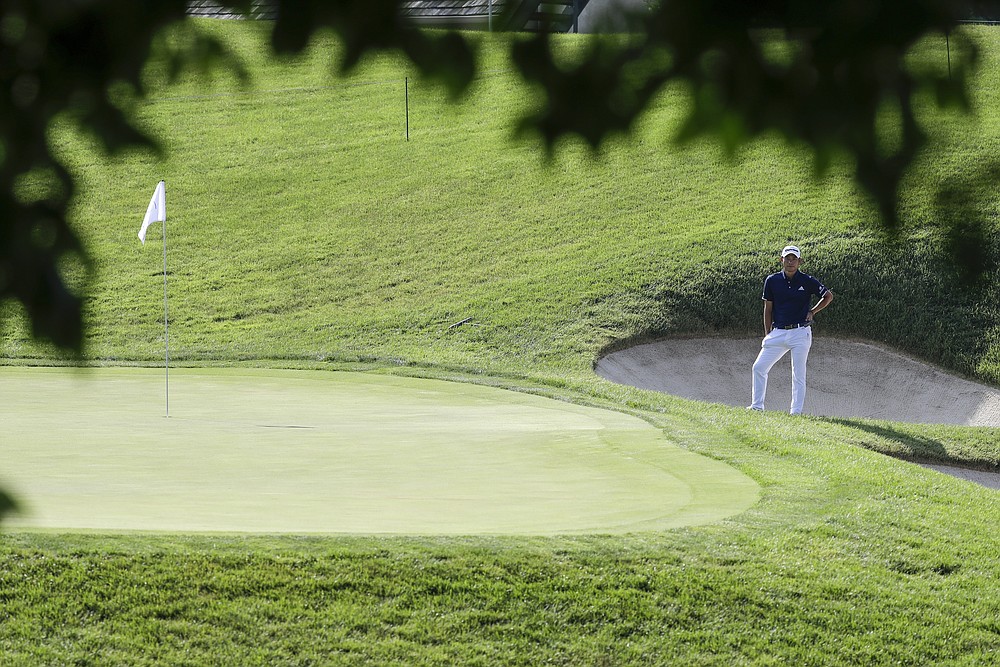 Collin Morikawa waits to putt on the 17th hole during the second round of the Workday Charity Open golf tournament, Friday, July 10, 2020, in Dublin, Ohio. (AP Photo/Darron Cummings)