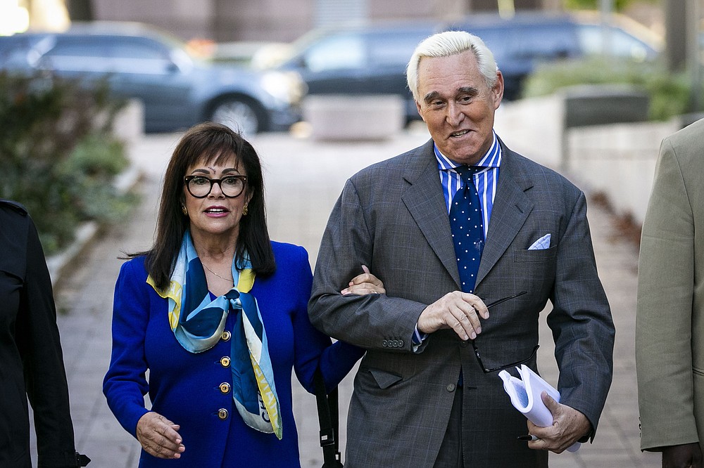 FILE - In this Nov. 8, 2019, file photo, Roger Stone, and his wife Nydia, arrive at federal court in Washington. (AP Photo/Al Drago, File)
