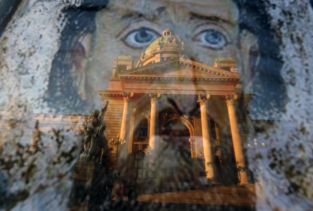 Protesters hold an icon during a protest in front of Serbian Parliament building in Belgrade, Serbia, Friday, July 10 2020. Serbia's President Aleksandar Vucic said Friday he's not worried about losing political power amid large protests against his handling of the coronavirus crisis and hard-line rule, but instead expressed his fear about the spread of the virus by the demonstrators. The spontaneous protests started on Tuesday when Vucic announced that Belgrade would be placed under a new three-day lockdown following a second wave of confirmed coronavirus infections. (AP Photo/Darko Vojinovic)