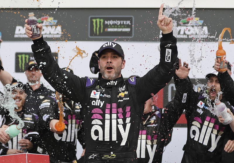 Seven-time NASCAR champion Jimmie Johnson celebrates in Victory Lane after winning the Feb. 10 NASCAR Clash at Daytona International Speedway in Daytona Beach, Fla. Johnson has twice tested negative for the coronavirus and has been cleared to race today at Kentucky Speedway. Johnson missed the first race of his Cup career when he tested positive last Friday. - Photo by John Raoux of The Associated Press