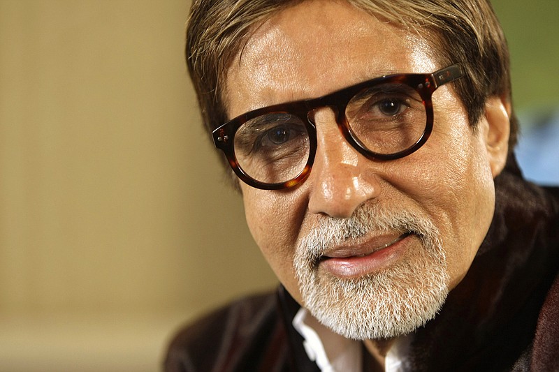 FILE - In this Nov. 10, 2009 file photo, Bollywood legend Amitabh Bachchan speaks during an interview in London. Bachchan has tested positive for COVID-19 and hospitalised in Mumbai, India's financial and entertainment capital. In a tweet on Saturday, July 11, 2020, Bachchan, 77, said his family and staff have also undergone tests and results are awaited. (AP Photo/Alastair Grant, File)