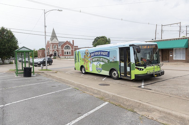 An Ozark Regional Transit bus leaves a stop Friday July 10, 2020 in downtown Rogers. (NWA Democrat-Gazette/Spencer Tirey)