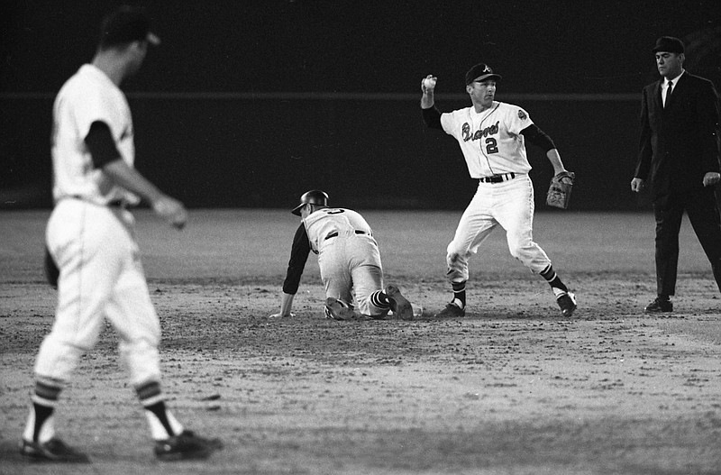 Atlanta Braves second baseman Frank Bolling (2) throws the ball against the Pittsburgh Pirates on April 12, 1966, during the first Major League Baseball game in the southeast at Atlanta-Fulton County Stadium. Bolling, a two-time All-Star second baseman and the last player to hit a grand slam off Sandy Koufax, has died. He was 88. Bolling died Saturday. - Photo by Marion Crowe/Atlanta Journal-Constitution via The Associated Press