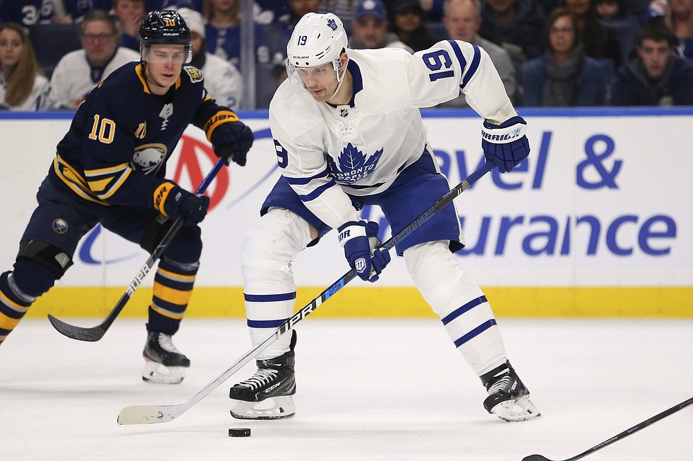 FILE - In this Sunday, Feb. 16, 2020 file photo, Toronto Maple Leafs forward Jason Spezza (19) controls the puck during the second period of the team's NHL hockey game against the Buffalo Sabres in Buffalo, N.Y. Jason Spezza's confidence in the NHL returning wasn't shaken by word of 11 players testing positive for the coronavirus. Given his involvement in Players' Association talks, the veteran Toronto forward knew from doctors' input that there would be positive test results in hockey just as there have been in other sports as group workouts ramp up across North America.(AP Photo/Jeffrey T. Barnes, File)