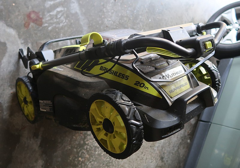 This Ryobi mower folds for storage. (Special to the Democrat-Gazette/Janet B. Carson)