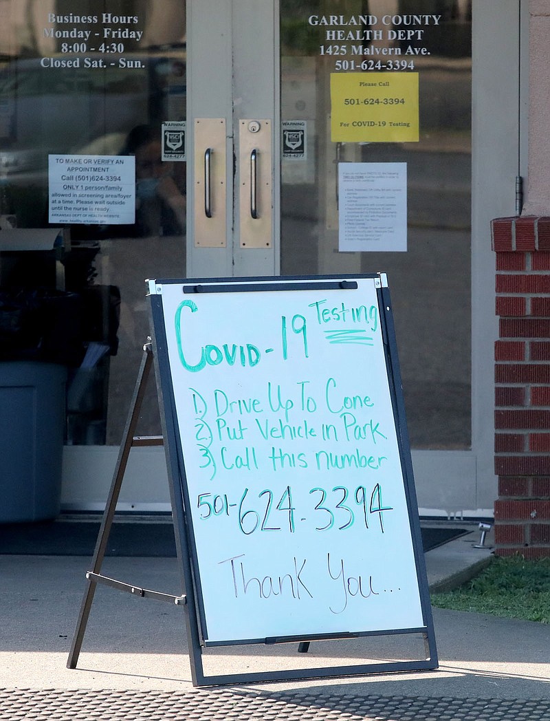 A sign instructs the public how to be tested for COVID-19 at the Garland County Health Unit, 1425 Malvern Ave. The Arkansas Department of Health's Local Health Units across the state began offering COVID-19 testing in May. Testing is encouraged for all individuals who believe they have had contact with or been exposed to a positive case as well as anyone who is experiencing symptoms of COVID-19. There is no out-of-pocket cost for the tests, but insurance may be billed for patients who have it. - Photo by Richard Rasmussen of The Sentinel-Record story.lead_photo.caption