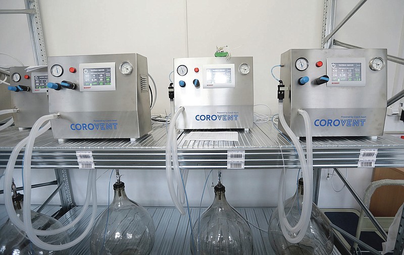 Lung ventilators manufactured in Trebic, Czech Republic, being tested on Wednesday, June 17, 2020. A group of volunteers in the Czech Republic was working round the clock to prevent critical shortage of ventilators for COVID-19 patients. A team of 30 developed a fully functional ventilator _ named Corovent _ in just days. They secured the necessary finances through crowdfunding, approached a leading expert in the field with a request for help and gave him all possible support. (AP Photo/Petr David Josek)