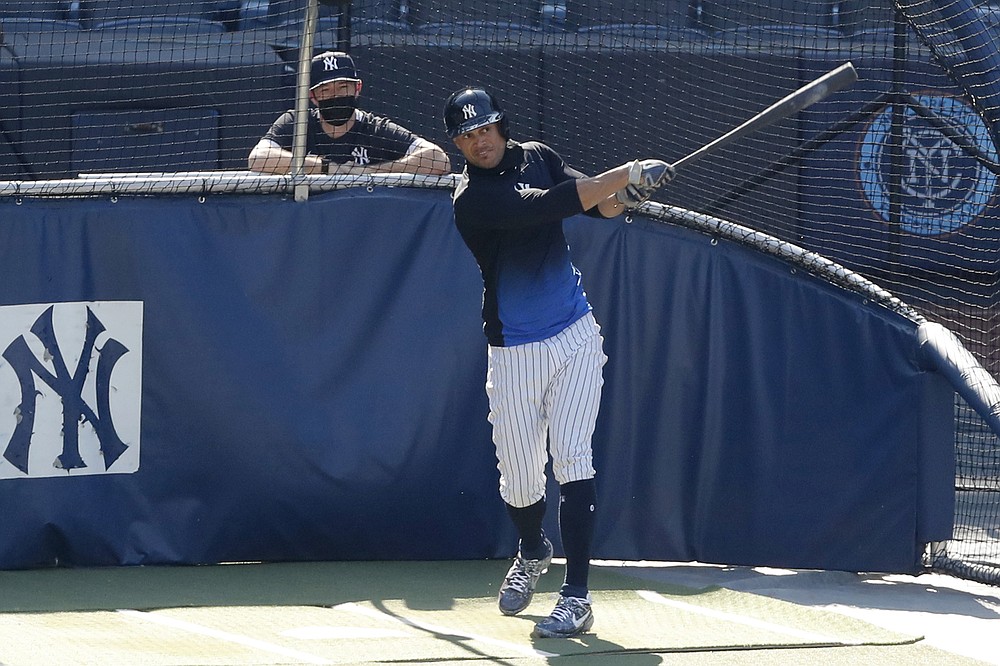 FILE - In this July 5, 2020, file photo, New York Yankees designated hitter Giancarlo Stanton bats during summer baseball training at Yankee Stadium in New York. Nothing changes the New York Yankees' mission, not the novel coronavirus, not a 60-game regular season. Winning the World Series is the sole focus. (AP Photo/Kathy Willens)