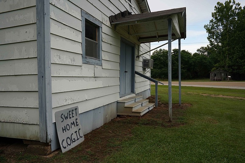 The original intention of the project was for Don House to contribute portraits, black and white photos taken of a smattering of the library’s patrons and employees, and Schmidt would record the community around the library with her color photography. This is the Sweet Home C.O.G.I.C. Building in Sweet Home, Ark.
(Photo by Sabine Schmidt) story.lead_photo.caption