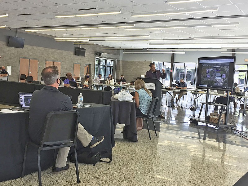 The Fayetteville School Board listens to a presentation by Athletic Director Steve Janski during its meeting in the Fayetteville High School cafeteria on Thursday, July 16, 2020.
(NWA Democrat-Gazette/DAVE PEROZEK)