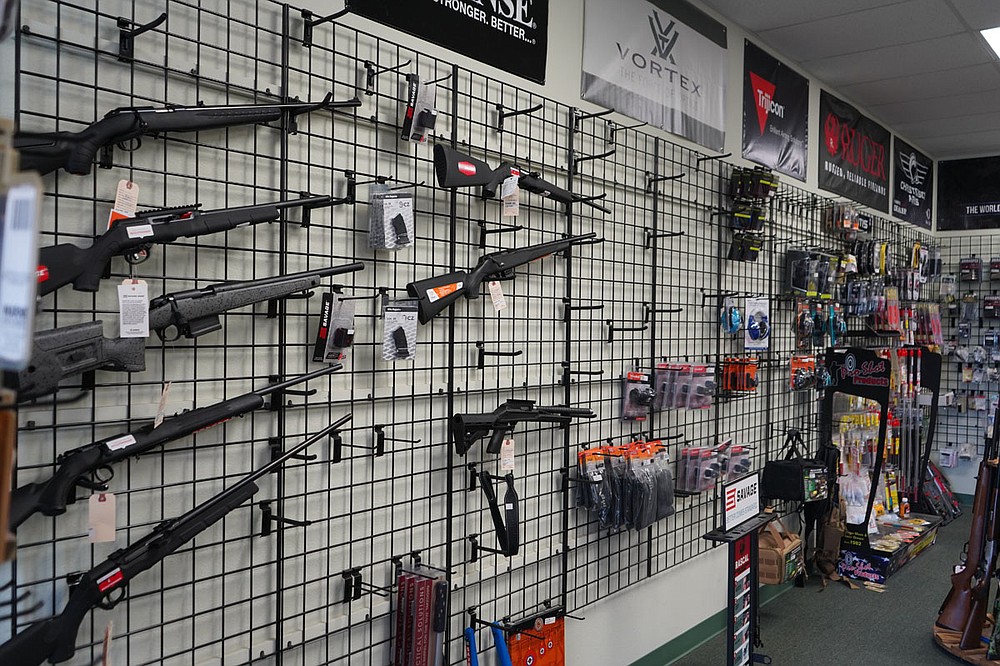 A half-empty gun rack at Arego’s Wholesale Guns in shown on Friday. - Photo by Cassidy Kendall of The Sentinel-Record