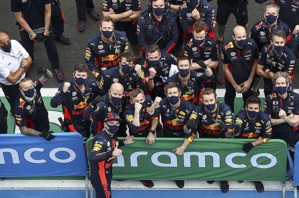 Red Bull driver Max Verstappen of the Netherlands celebrates with his mechanics after the Hungarian Formula One Grand Prix race at the Hungaroring racetrack in Mogyorod, Hungary, Sunday, July 19, 2020. (Mark Thompson/Pool via AP)