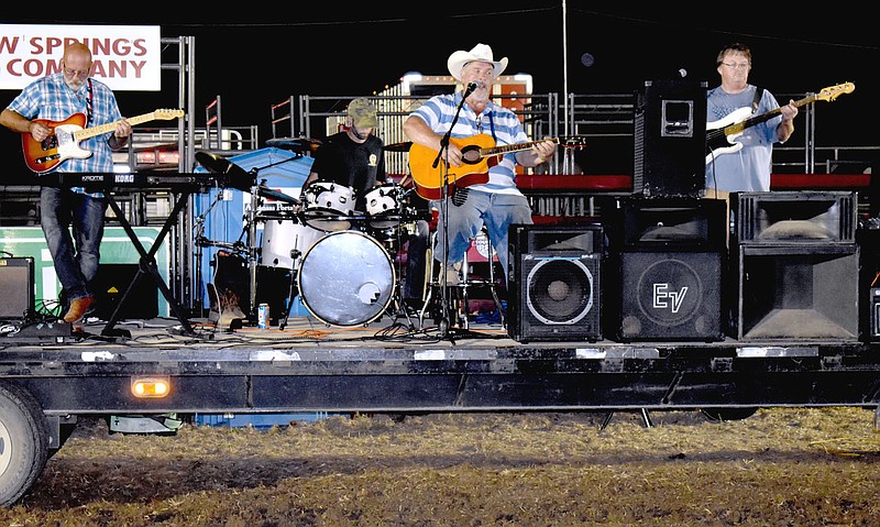 MARK HUMPHREY  ENTERPRISE-LEADER/ Phil McGarrah and his band, “Runnin’ On Empty” performed live after Saturday's bull riding concluded at the Ogden Ranch. McGarrah opened with an original composition, “Huckleberry Lane,” based on memories of attending Harvey Jones Elementary School and his teacher, Jean Fitch, mother of "Bucking' At The Ranch" promoter Nathan Ogden’s wife, Tracy, and grandmother to the couple’s daughters, Oaklie and Huntlea.