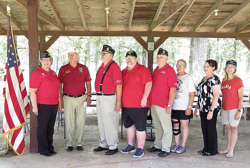 Westside Eagle Observer/RANDY MOLL
The officers of the newly reopened Gentry American Legion Post 159 posed for a photo after being installed on Saturday, July 18, in Gentry City Park. Pictured with Arkansas Department Commander Doyle Batey (second from left) are Marie Wilbanks, commander; Denver Whitehead, first vice president; Joe Zelk, second vice president; Jim Wilbanks, adjutant; Karla Wike, sergeant of arms; Kateri Killman, finance officer; and Karla Sipe, chaplain.