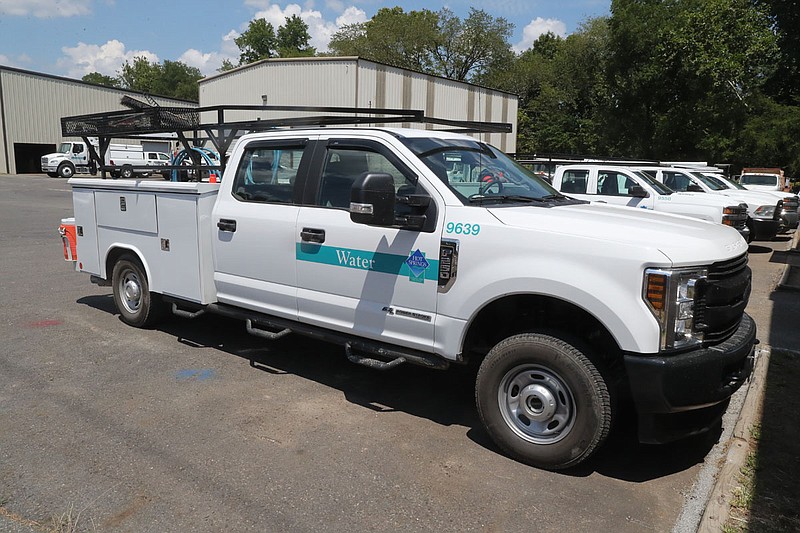 City utility trucks are parked July 20, 2020, at the wastewater department on Adams Street. - Photo by Richard Rasmussen of The Sentinel-Record