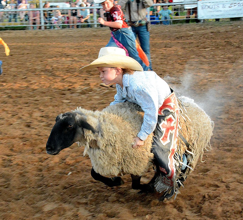 Janelle Jessen/Herald-Leader
Karson Summerfield of Kansas, Okla., won the mutton busting event on Friday evening during the 62nd annual Siloam Springs Rodeo.