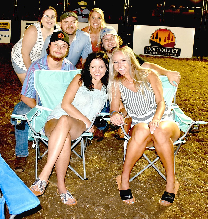 MARK HUMPHREY  ENTERPRISE-LEADER/Farmington alumni were among this group: Brianna Murphree, Travis Murphree, Kenzie Sill, Josh Blew, Hayden Edwards, Tatum Palmer and Taylor Leher enjoying a concert after Saturday's bull riding during a PBR Touring Pro Division event held at the Ogden Ranch south of Prairie Grove.