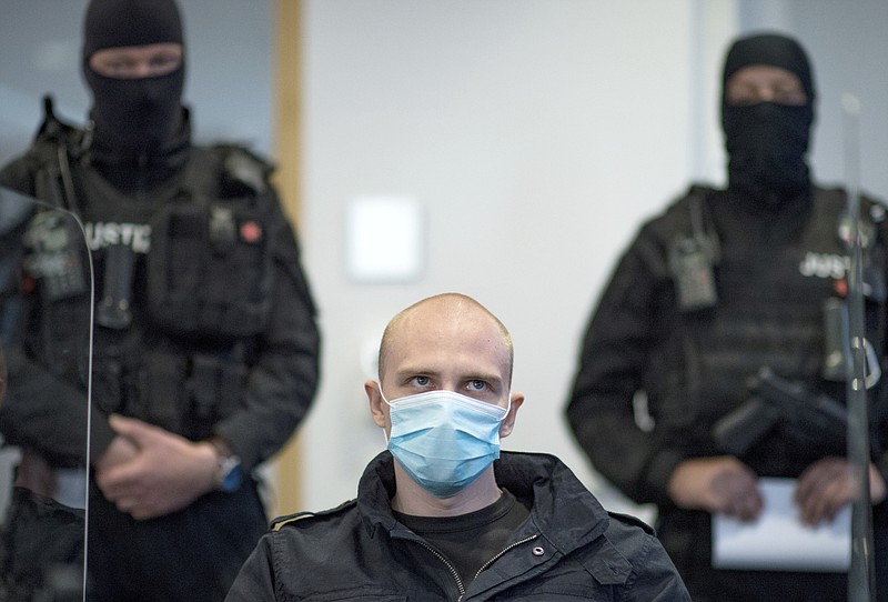 Accused Stephan Balliet sits in the courtroom of the regional court at the beginning of the trial in Magdeburg, Germany, Tuesday, July 21, 2020. Balliet is charged with 13 crimes including murder and attempted murder, for a Yom Kippur attack on a synagogue on Oct. 9 in the eastern German city of Halle, that is considered one of the worst anti-Semitic assaults in the country's post-war history. (Hendrik Schmidt/dpa via AP) story.lead_photo.caption