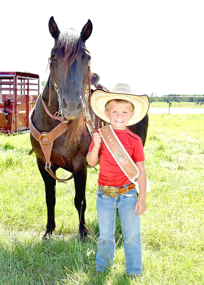 MARK HUMPHREY  ENTERPRISE-LEADER/Gauge Perkins, 4, son of Charlie and Christy Perkins, of Farmington, won the 2019 Lincoln Riding Club Lil' Mister title. Gauge is holding the reins of Rowdy, a 12-year-old Quarterhorse gelding. The 67th annual Lincoln Rodeo will be held Aug. 6-8 at the Lincoln Riding Club Arena.