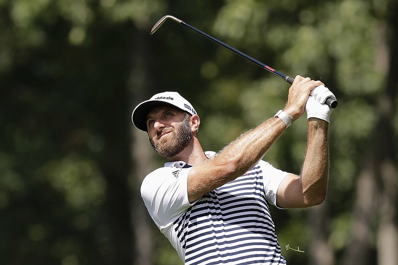 FILE - In this Friday, July 17, 2020, file photo, Dustin Johnson hits toward the ninth green during the second round of the Memorial golf tournament in Dublin, Ohio. The 3M Open comes to Minnesota for the second time, with heavy hitters Dustin Johnson and Brooks Koepka headlining the field. (AP Photo/Darron Cummings, File)