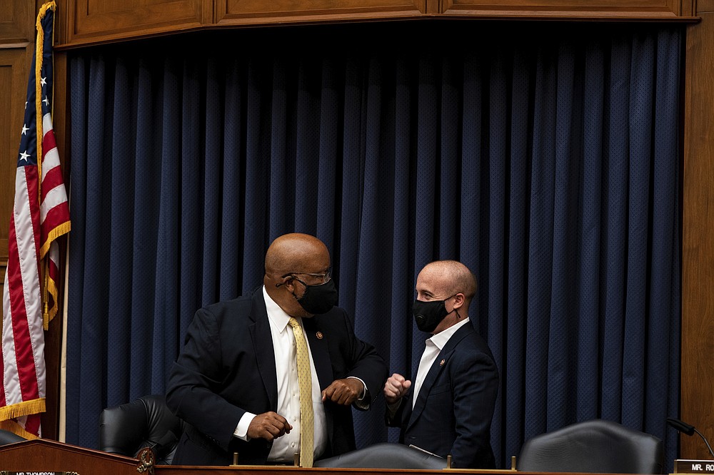 Rep. Bennie Thompson, D-Miss., chairman of the House Committee on Homeland Security, greets Rep. Max Rose, D-N.Y., right, before a House Committee on Homeland Security meeting on Capitol Hill in Washington, Wednesday, July 22, 2020, on the national response to the coronavirus pandemic. (Anna Moneymaker/The New York Times via AP, Pool)