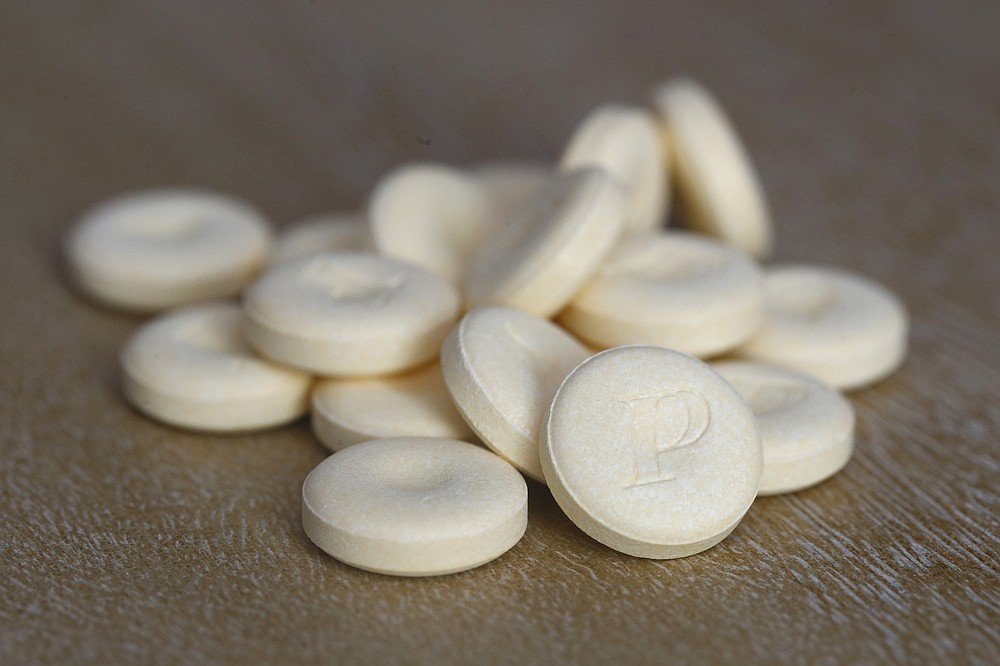 This June 15, 2020 photo shows tablets of Pepcid antacid in Washington. The U.S. government's Pepcid project has revealed what critics describe as the Trump administration’s disregard for science and anti-corruption rules meant to guard against taxpayer dollars going to political cronies or funding projects that aren’t rigorously designed. (AP Photo/Patrick Semansky)