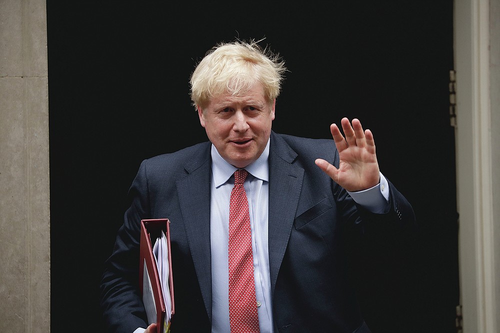 FILE - British Prime Minister Boris Johnson leaves number 10 Downing Street, to attend Prime Minister's Questions at the Houses of Parliament in London on July 8, 2020. The countries which top the rankings of COVID-19 deaths globally are led by populist, mold-breaking leaders like Johnson. The U.S., Brazil, the United Kingdom and Mexico all are led by leaders who have been skeptical of the scientists and who initially minimized the disease. And their four countries alone account for half of the total 585,000 COVID-19 deaths worldwide so far, according to statistics tracked by Johns Hopkins University. (AP Photo/Matt Dunham, File)