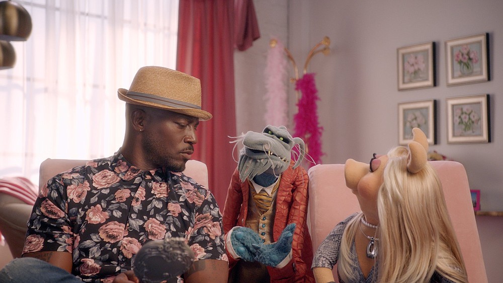 Taye Diggs (from left), Uncle Deadly and Miss Piggy appear in a scene from “Muppets Now,” a new series on Disney+.