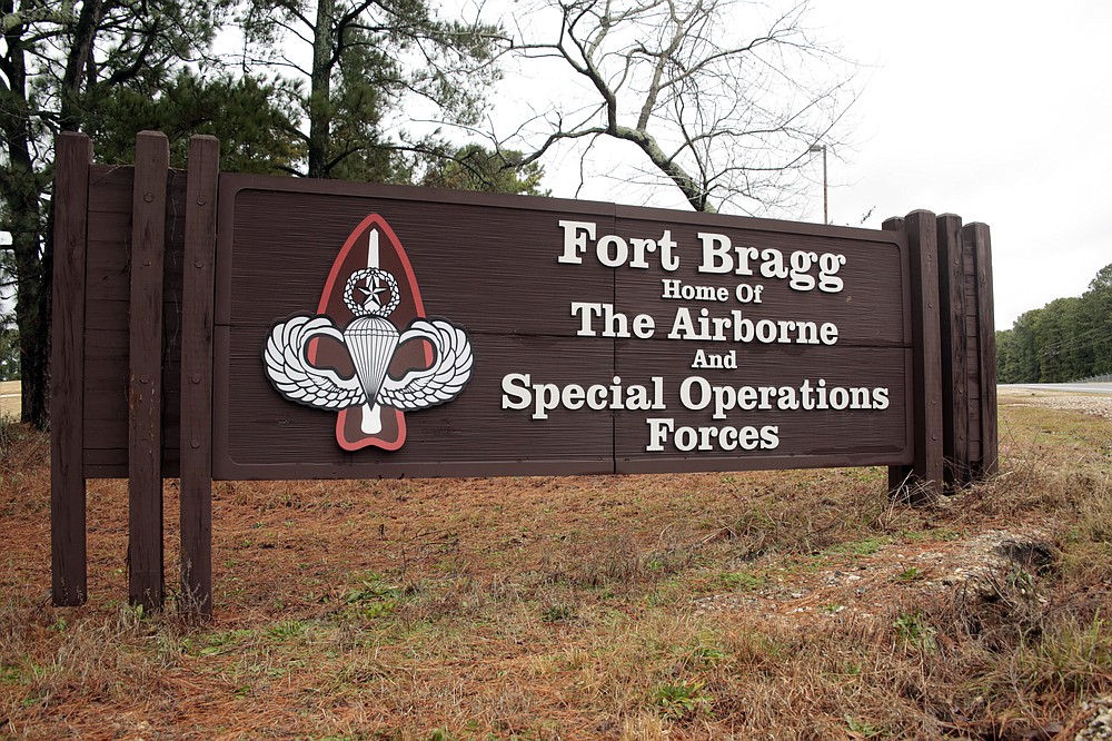 FILE - In this Jan. 4, 2020, file photo a sign for at Fort Bragg, N.C., is shown. A female soldier has graduated from the Army’s elite Special Forces course and will for the first time join one of the all-male Green Beret teams. (AP Photo/Chris Seward, File)
