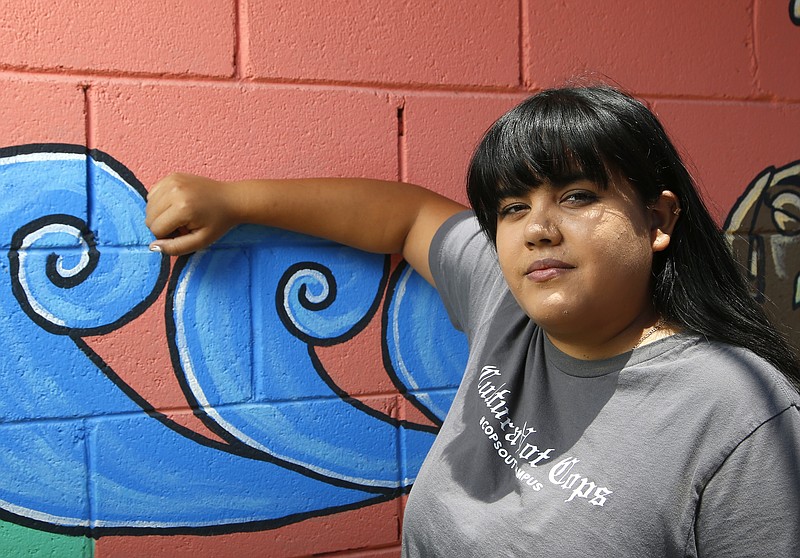 Michelle Ruiz, who started the student-led movement to get police out of schools in the Phoenix Union High School District, shown here at the Puente offices Thursday, June 18, 2020, in Phoenix.  School districts around the country are voting to eliminate police from public schools. But this isn’t a sudden reaction to the killing of George Floyd in Minneapolis, but to a years-long movement led by students who say they feel unsafe with police on campus. (AP Photo/Ross D. Franklin)