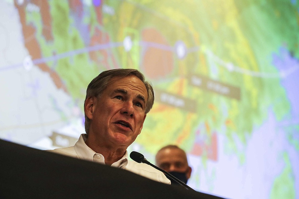 Gov. Greg Abbott provides an update on the state's ongoing response to Hurricane Hanna in Austin, Texas on Saturday, July 25, 2020. (Lola Gomez/Austin American-Statesman via AP)