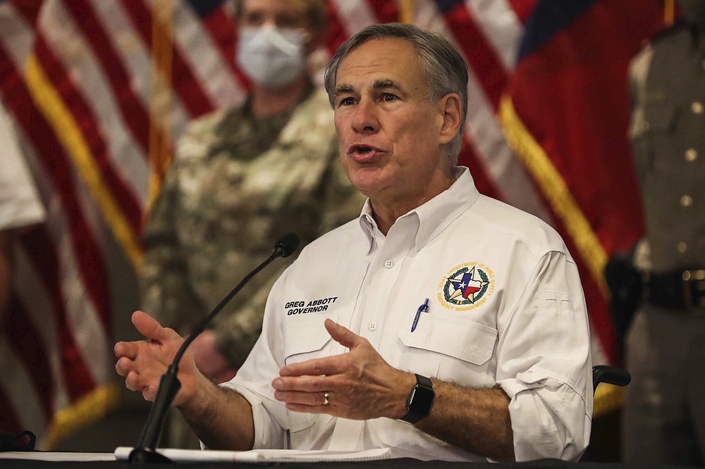 Gov. Greg Abbott provides an update on the state's ongoing response to Hurricane Hanna in Austin, Texas on Saturday, July 25, 2020. (Lola Gomez/Austin American-Statesman via AP)