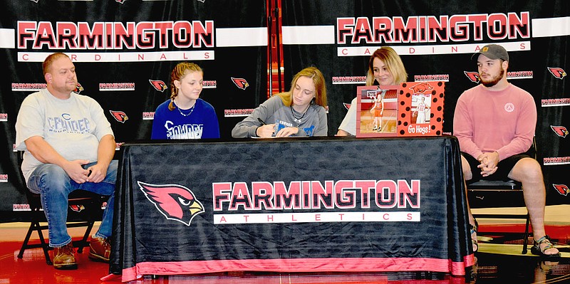 STAFF PHOTO/Farmington 2020 graduate Audrey Culpepper recently signed a national letter of intent to play women's college basketball at Crowder College, of Neosho, Mo. She was accompanied by her family (from left): Mike Mitchell, stepfather, Jenna Culpepper, sister; Audrey; Sara Mitchell, mother; and Jayden Carter, brother.