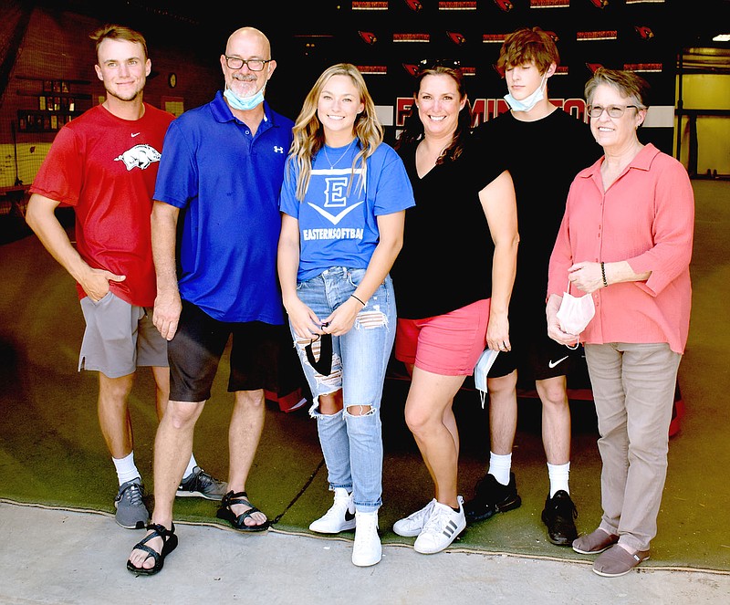 STAFF PHOTO/Farmington 2020 graduate Cambre Strange recently signed a national letter of intent to play women's college softball at Eastern Oklahoma. She was accompanied by her family (from left): Dalton Strange, brother; Darin Stranger, father; Michelle Strange, mother; Malachi Strange, brother; and Jo Beadle, grandmother.