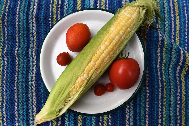 Nothing says summer like sweet corn and home-grown tomatoes.
(NWA Democrat-Gazette/Flip Putthoff)