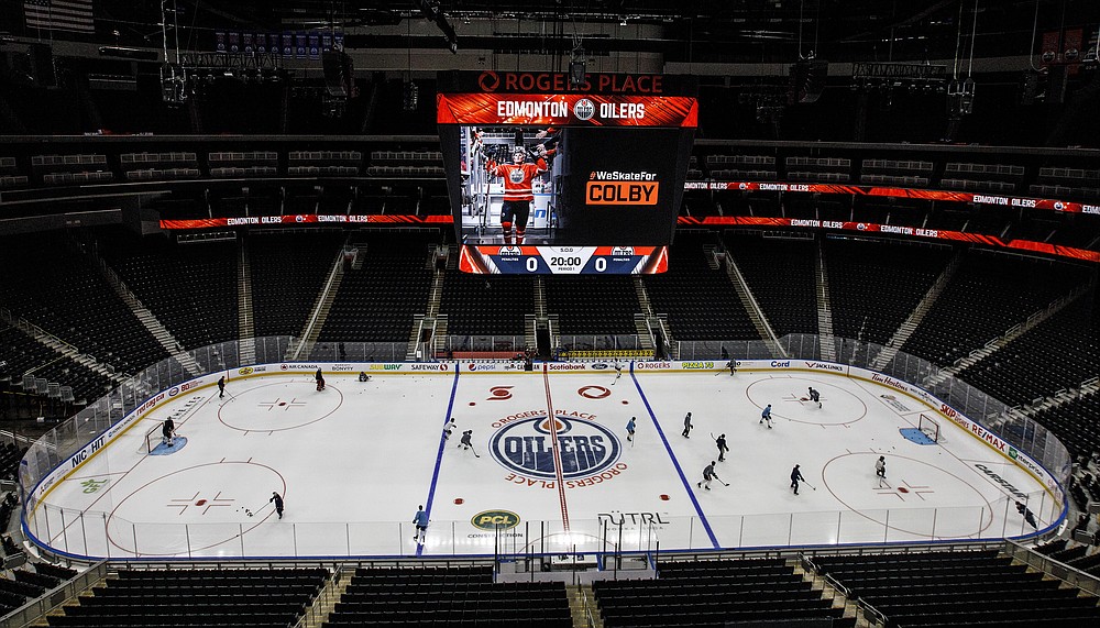 Edmonton Oilers players take to the ice for NHL hockey training camp in Edmonton on Monday, July 13, 2020. (Jason Franson/The Canadian Press via AP)