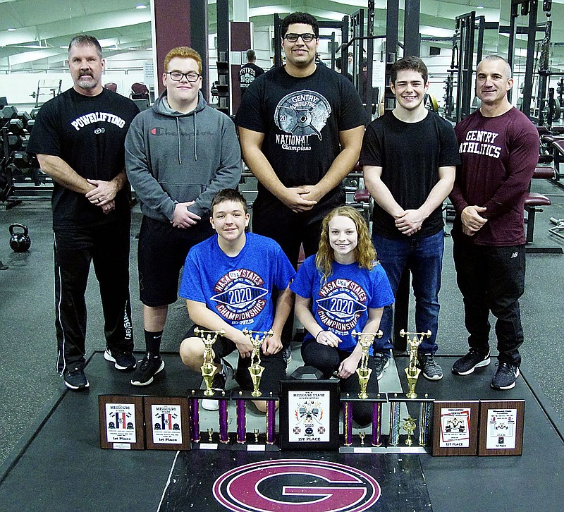Westside Eagle Observer/RANDY MOLL
Pictured with their trophies and awards from the NASA Missouri High School State Championships on Saturday, Jan. 25, at McAuley High School in Joplin, Mo., are Gentry High School powerlifters Camden Wright (front, left), Josie Newsom, Coach Sean Seligman (back, left), Isaiah Freeman, Kerlose Ruzek, William Pyburn and Coach Jamie Mcdougal.