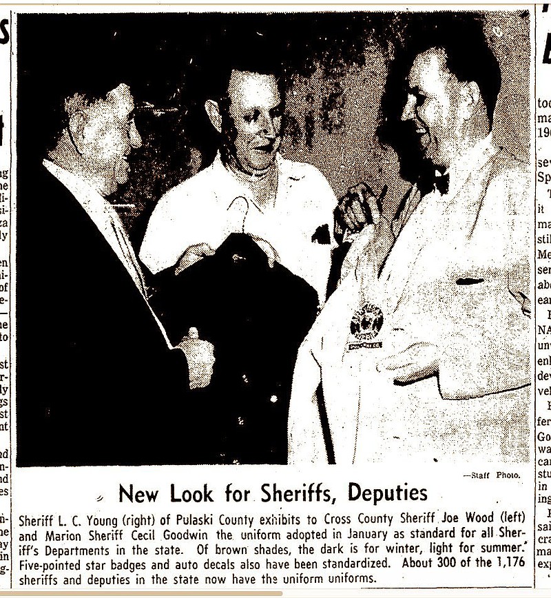 Crittenden County Sheriff Cecil V. Goodwin (center) compares new uniforms with those of Pulaski County Sheriff L.C. Young (right) and Cross County Sheriff Joe Wood in a photo of a clipping from the Arkansas Gazette in1960. Goodwin served from 1943-64 and was in charge when Isadore Banks was lynched. He refused to call it a lynching, though, and a short investigation ended with no charges filed. His widow, Maggie Sue Goodwin, died in 1999, leaving her church a $7 million bequest. 

(Arkansas Democrat-Gazette)