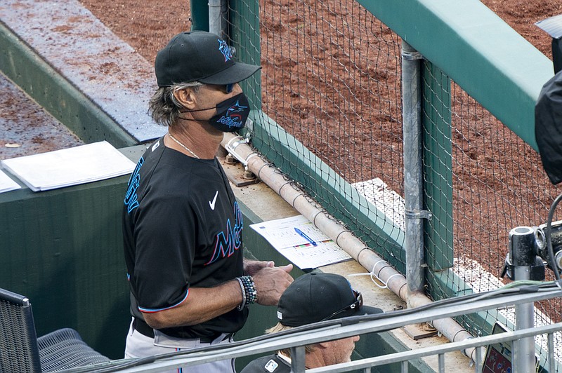 Miami Marlins' manager Don Mattingly looks out from the dugout during the eighth inning of Saturday's game against the Philadelphia Phillies in Philadelphia. - Photo by Chris Szagola of The Associated Press