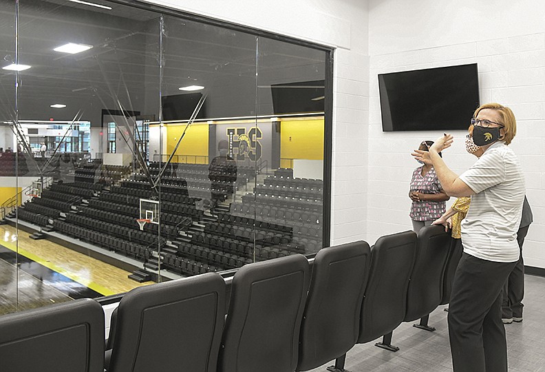 Hot Springs School District Superintendent Stephanie Nehus gives a tour of the new Trojan Arena following a ribbon cutting for the new Hot Springs Junior Academy and arena on Wednesday, July 29, 2020. - Photo by Grace Brown of The Sentinel-Record