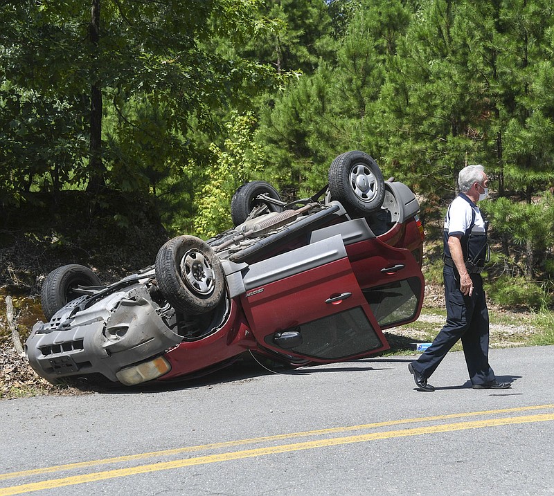 The Hot Springs Police Department worked a single-vehicle accident in the 100 block of Cedar Glades Road on Thursday that injured an unidentified woman. - Photo by Grace Brown of The Sentinel-Record story.lead_photo.caption