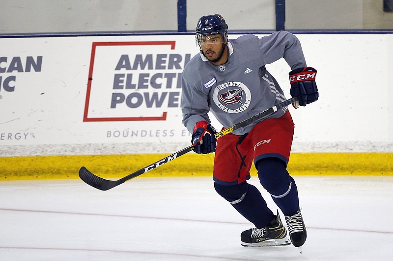 FILE - In this July 20, 2020, file photo, Columbus Blue Jackets' Seth Jones skates  during the NHL hockey team's practice in Columbus, Ohio. Jones, Pittsburgh forward Jake Guentzel and Tampa Bay captain Steven Stamkos would’ve missed some or all of the playoffs if they started in April. Instead, the silver lining of the COVID-19 pandemic halting the season is those players are healthy and ready to contribute.  (AP Photo/Jay LaPrete, File)