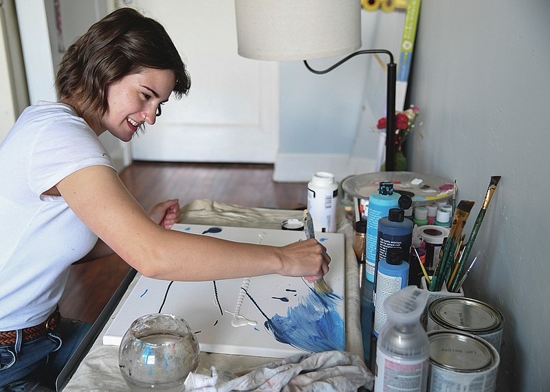 Loal Artist Selah Rodgers works on a piece in her home on July 26.-Photo by Grace Brown of The Sentinel-Record