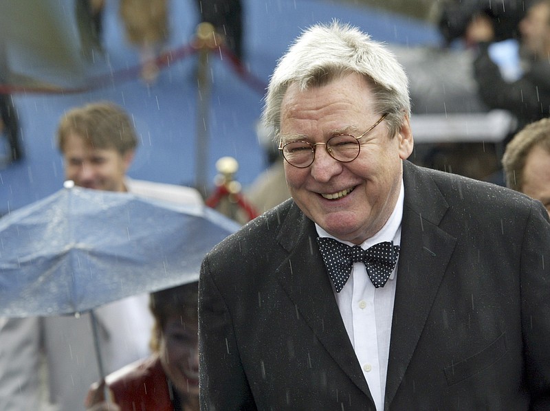 FILE - Film director Alan Parker arrives at the opening ceremony of 26th Moscow International Film Festival in Moscow on June 18, 2004. Parker, whose movies included “Bugsy Malone,” “Midnight Express” and “Evita,” has died at the age of 76. A statement from the director’s family says Parker died Friday in London after a long illness. (AP Photo/Misha Japaridze, File)